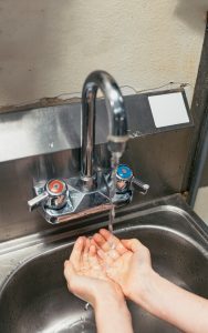 WASHING YOUR HANDS IS THE BEST WAY TO PREVENT THE SPREAD OF CORONAVIRUS. PHOTO BY ALLIE SMITH ON UNSPLASH