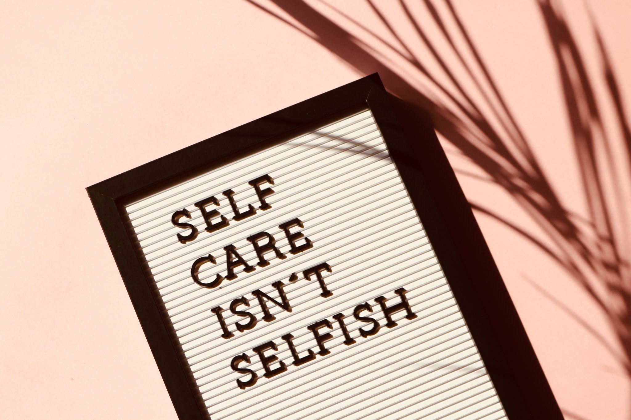 OKAY SELF CARE. PHOTO MADISON INOUYE / PEXELS