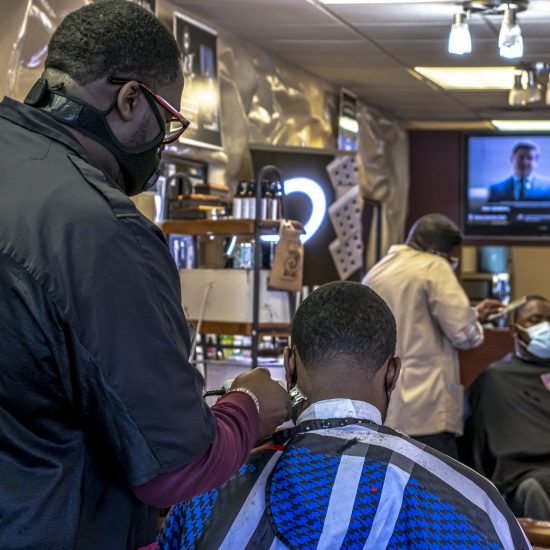 Barber // DEANGELO SMITH SR AND OTHER BARBERS INISDE EXECUTIVE CUTS. PHOTO JOPHN BOZICK