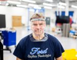LOCKDOWN // A WORKER WEARS A PROTOTYPE OF A 3D-PRINTED MEDICAL FACE SHIELD PRINTED AT FORD’S ADVANCED MANUFACTURING CENTER. PHOTO FORD MOTOR COMPANY