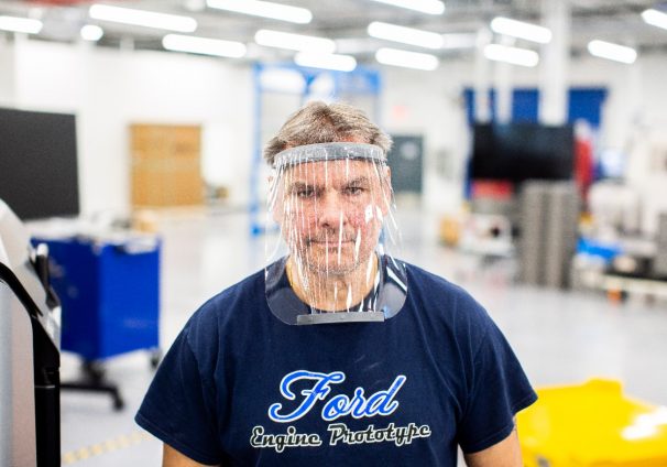 LOCKDOWN // A WORKER WEARS A PROTOTYPE OF A 3D-PRINTED MEDICAL FACE SHIELD PRINTED AT FORD’S ADVANCED MANUFACTURING CENTER. PHOTO FORD MOTOR COMPANY