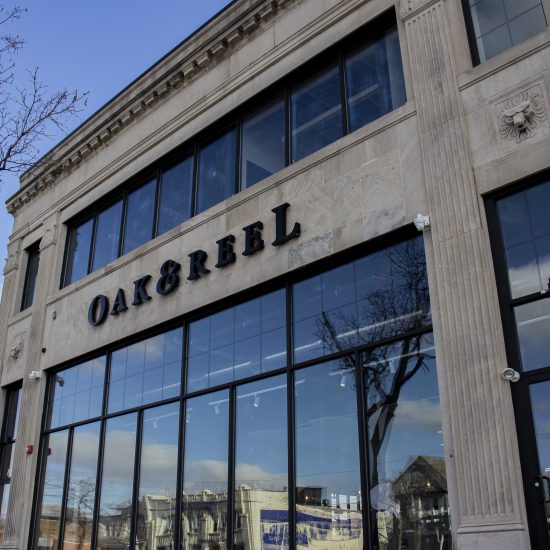 STONE BUILDING WITH A SIGN ON IT // OAK & REEL, LOCATED IN THE MILWAUKEE JUNCTION NEIGHBORHOOD. PHOTO JOHN BOZICK