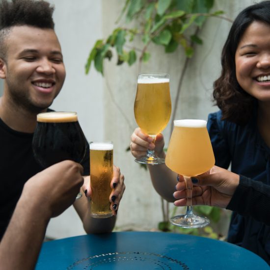 People gather with drinks for St. Patrick's day // PHOTO BY KELLY SIKKEMA / UNSPLASH