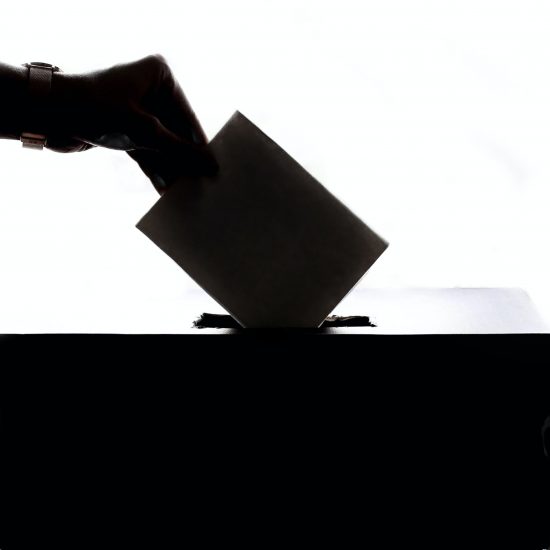 person putting envilope in the voting box // will the republican party make it harder to vote? // PHOTO BY ELEMENT5 DIGITAL ON UNSPLASH