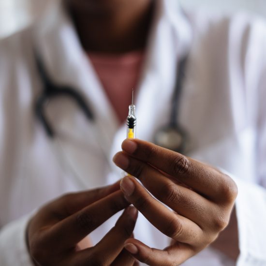 A PERSON HOLDING A VACCINE VIAL // COVID VACCINE IN MICHIGAN // PHOTO FROM RF STUDIO ON PEXELS