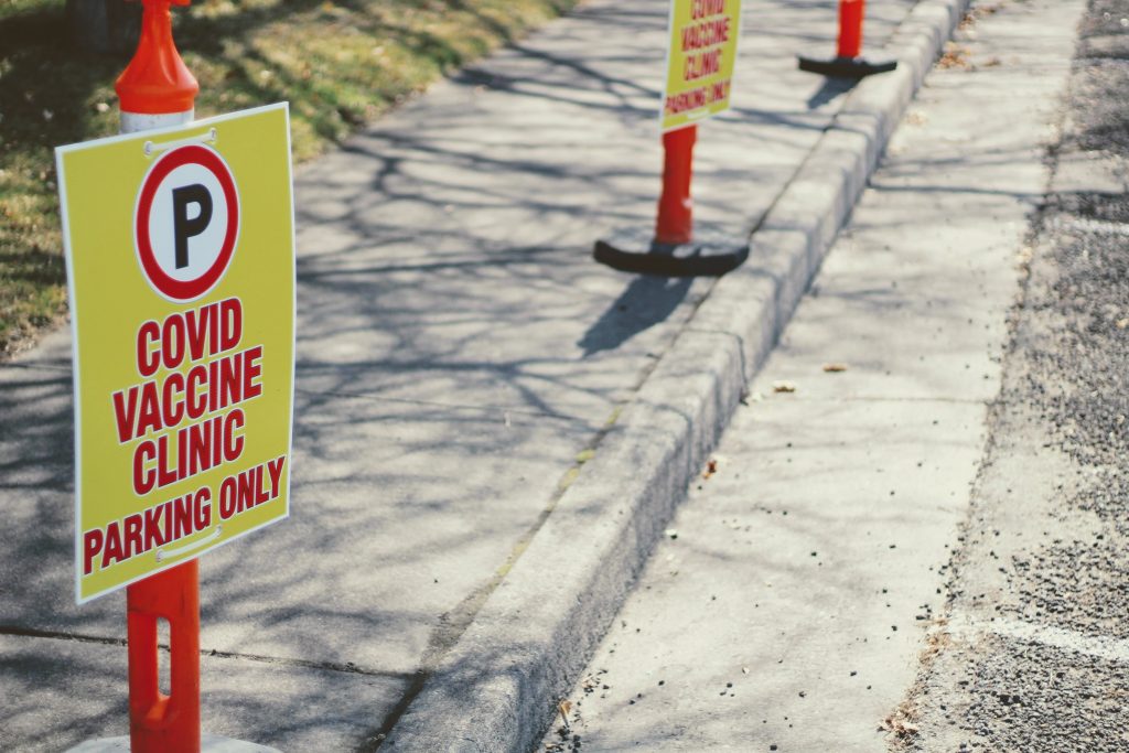 vaccine shot / cones with signs / PHOTO BY JOSHUA HOEHNE ON UNSPLASH