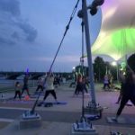 Moonlight yoga Detroit urban solace riverfront conservancy