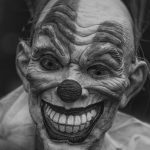 grayscale clown smiling