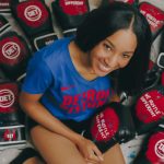 ALLISON SIMS WITH HER DETROIT PISTONS MERCH