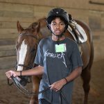 DETROIT HORSE POWER PROGRAM STUDENT CHARLES JOHNSON 13, WILLOWBROOKE FARMS IN PLYMOUTH. PHOTO LON HORWEDEL