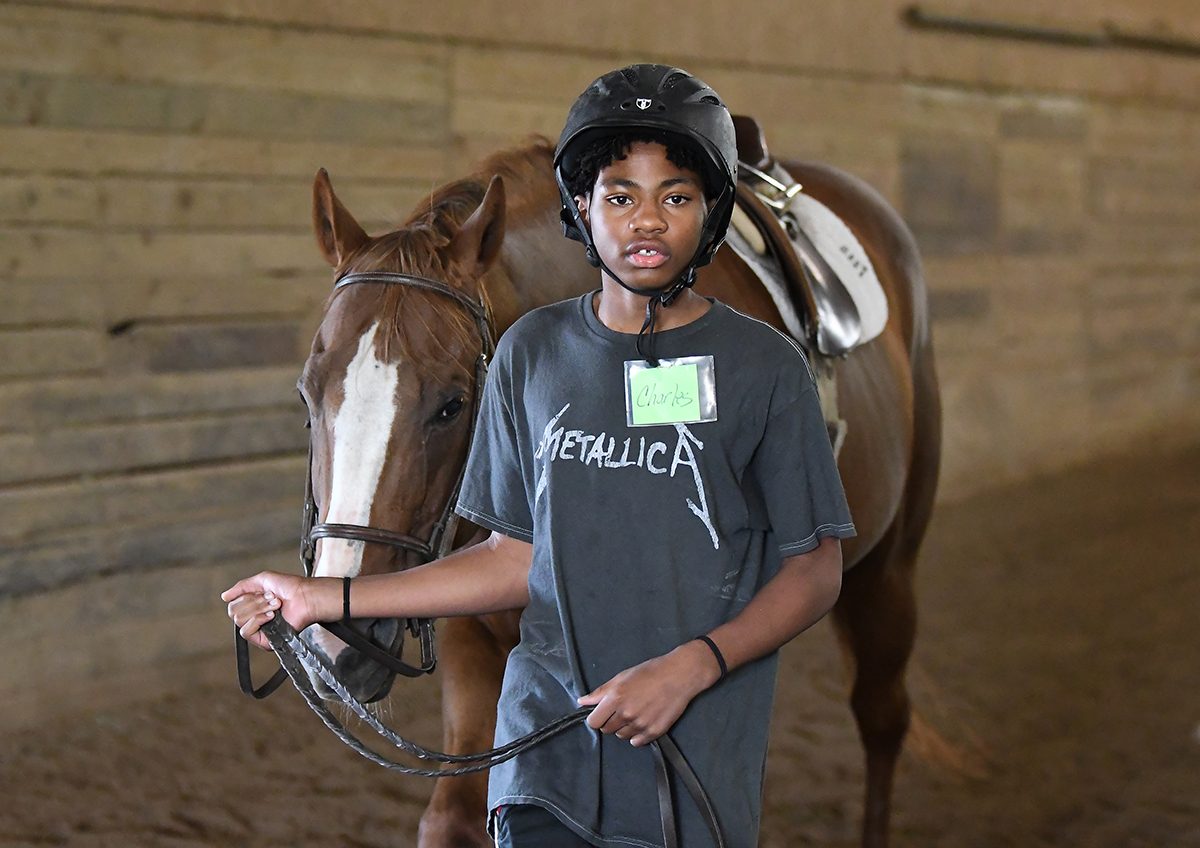 DETROIT HORSE POWER PROGRAM STUDENT CHARLES JOHNSON 13, WILLOWBROOKE FARMS IN PLYMOUTH. PHOTO LON HORWEDEL