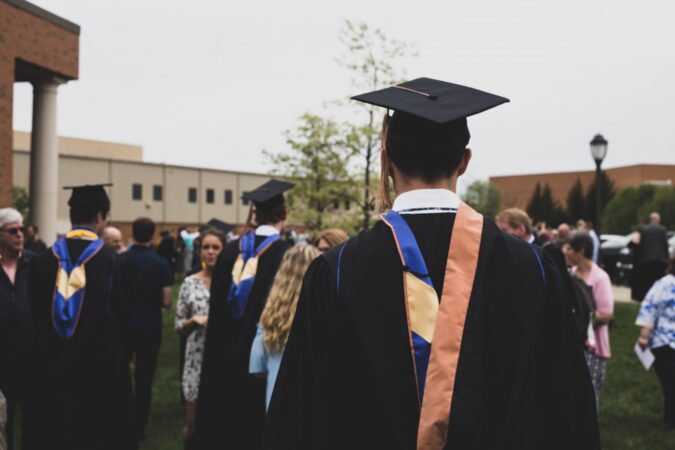 black history // man in graduation gown / history photo / black history month /PHOTO CHARLES DELOYE / UNSPLASH