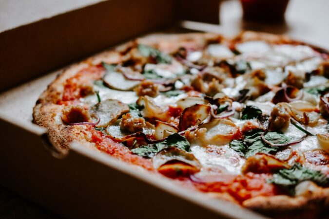 pizza being cut