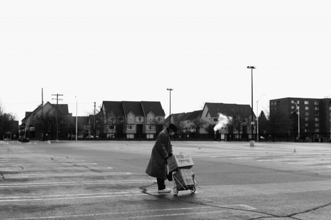 WOMAN WITH FOOD FROM FORGOTTEN HARVEST. PHOTO KENNY KARPOV