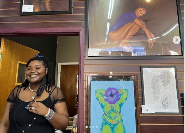 MINT ARTISTS GUILD VP, ALEXIS BAGLEY WITH HER ARTWORK IN DETROIT, PHOTO @lexxiiterrestrial ON INSTAGRAM