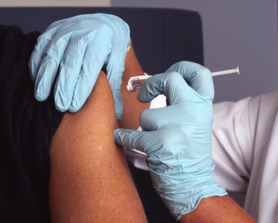 vaccine being administered // PHOTO FROM NATIONAL CANCER INSTITUTE ON UNSPLASH