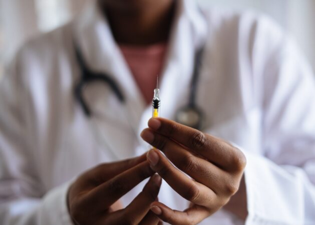 A PERSON HOLDING A VACCINE VIAL // COVID VACCINE IN MICHIGAN // PHOTO FROM RF STUDIO ON PEXELS